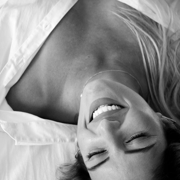 Alex Reed, Lead Design Curator at GentleWaveVault, reviewing corporate floral arrangements